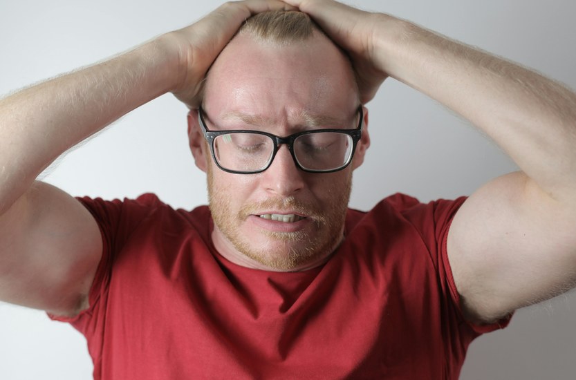 Man with glasses looking tired, weed withdrawal symptoms