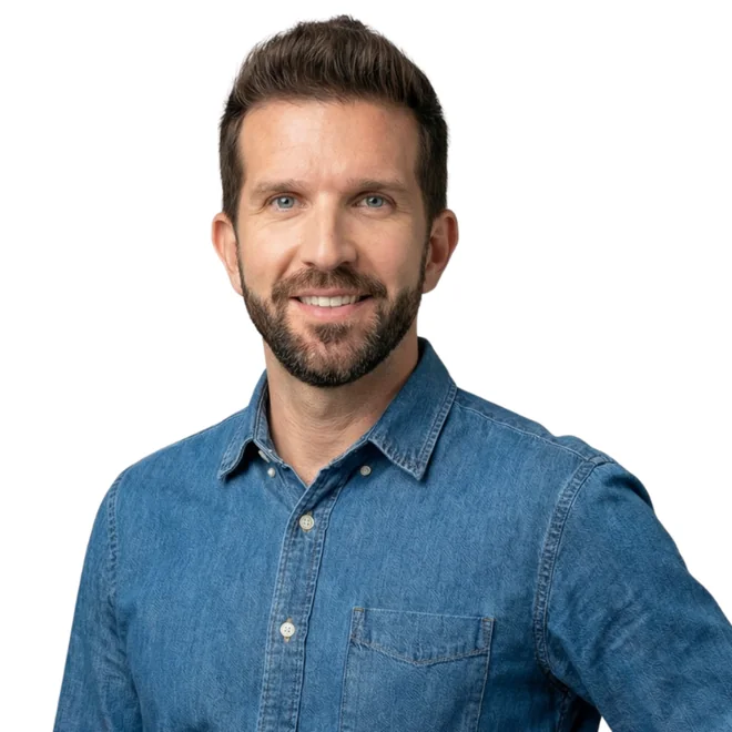 Smiling man with a beard in a denim shirt